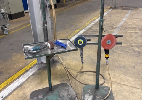 Collection of compressed air tools and work stands