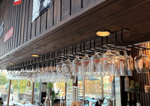 Lot of glasses and glass holders for bar counter