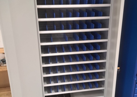 Tin cabinet with contents