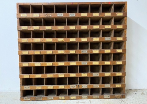 Older bolt and nut shelf with many compartments