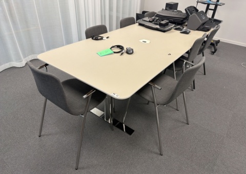 Conference table with 8 chairs and whiteboard