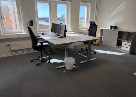 Workplace with office furniture and screens