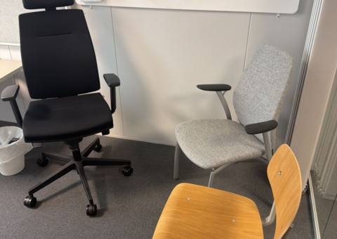 Office workplace with office furniture and acoustic board