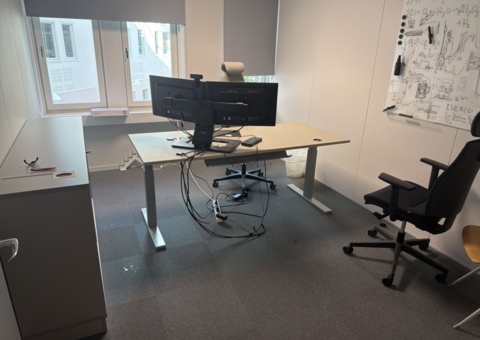 Office workplace with office furniture and screens