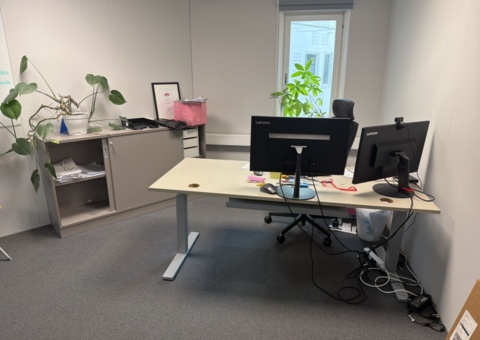 Office workplace with office furniture and screens