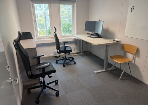 Office workplace with office furniture and screens