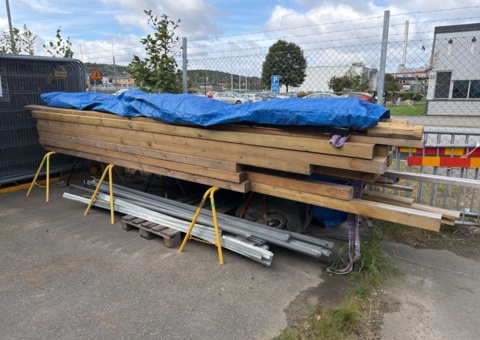 Collection of wooden beams and boards including trestles