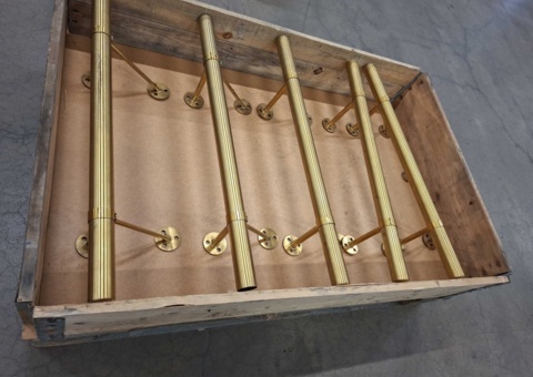 5 brass-colored rods