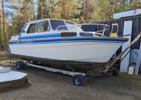 Cabin boat with sheet metal hull and Oldsmobile V8