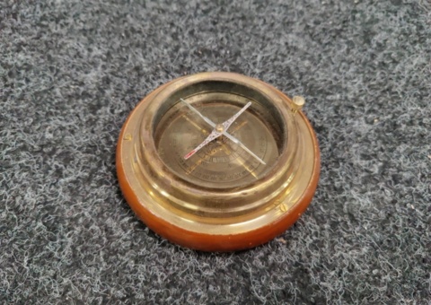 Ship's compass in brass and dark wood