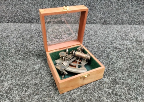 Brass sextant with maritime wooden box