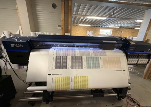 Divestment of large format printers