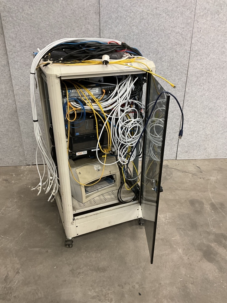 1473963-1 Computer cabinet with various items