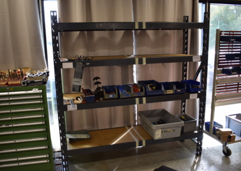 Steel workshop shelf with contents