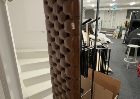 Brown leather bench with steel legs