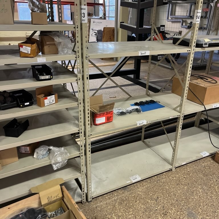 1580570-2 Sheet metal shelves with screws, bolts, electrical parts, pneumatics, etc.