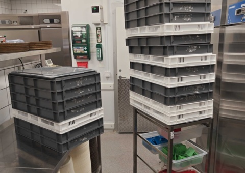 Plastic crates and transport trolley