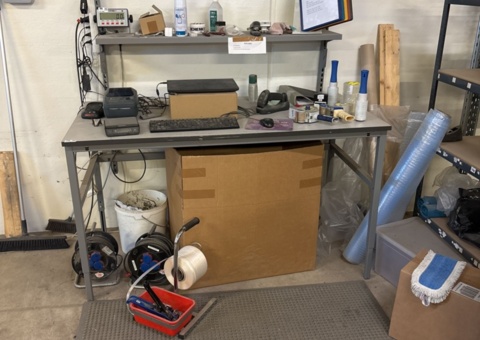 Packing table with shelf and various peripherals
