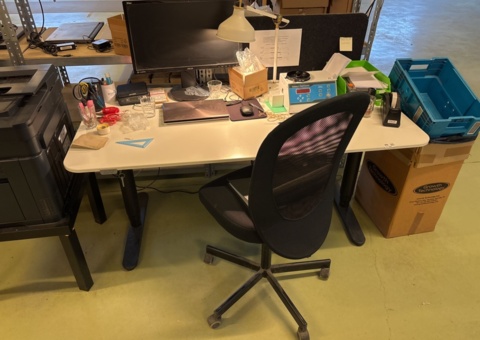 Workplace with electric desk, chair, monitor and digital scale