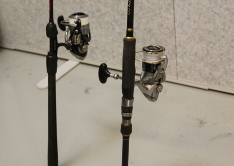 2 fishing rods with reels.