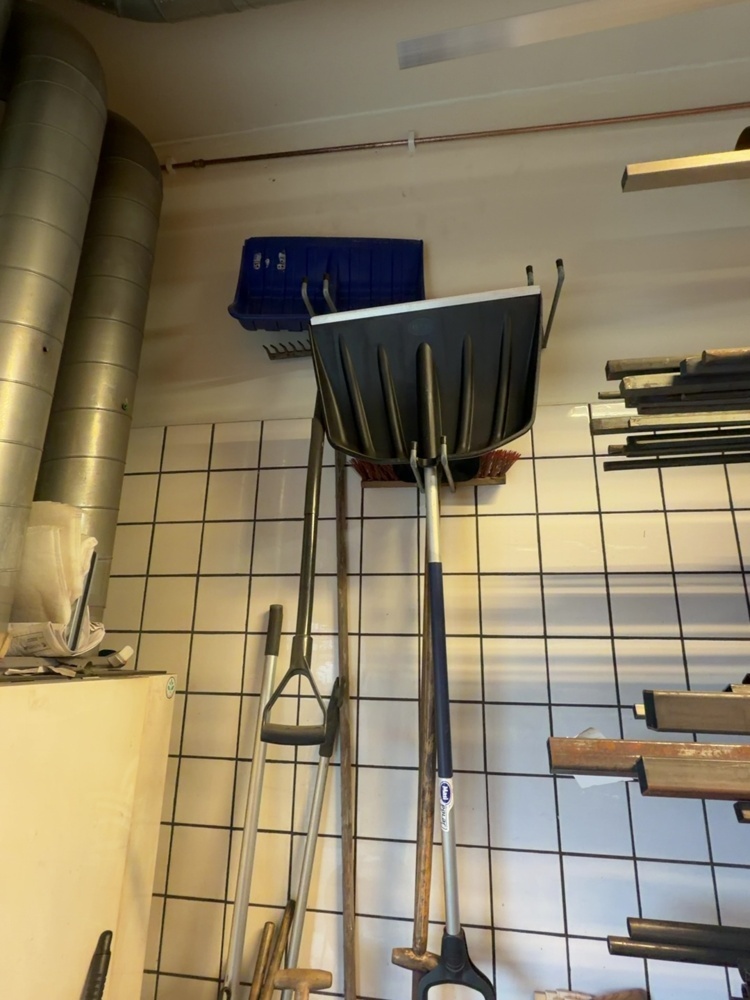 1574923-2 Everything in the corner - ladders, brooms and snow shovels
