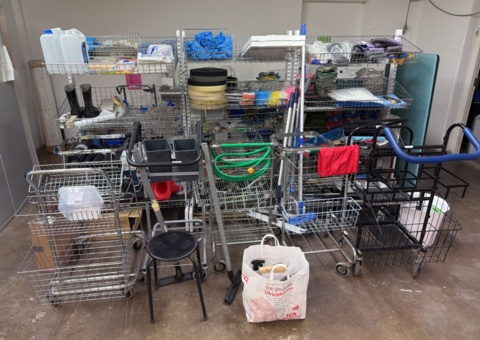 Larger collection of cleaning carts, cleaning equipment and wire shelves