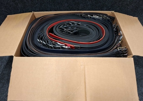 Approximately 175 leather belts, sizes 75-130