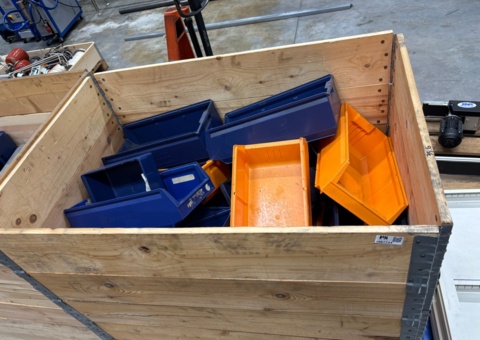 Pallet with plastic boxes