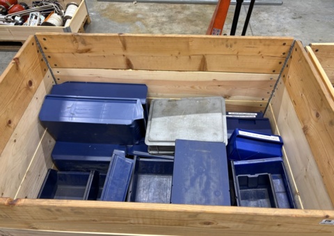 Pallet with plastic boxes