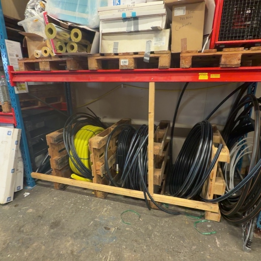 1594841-2 Pallet racking with plumbing parts, tools and equipment