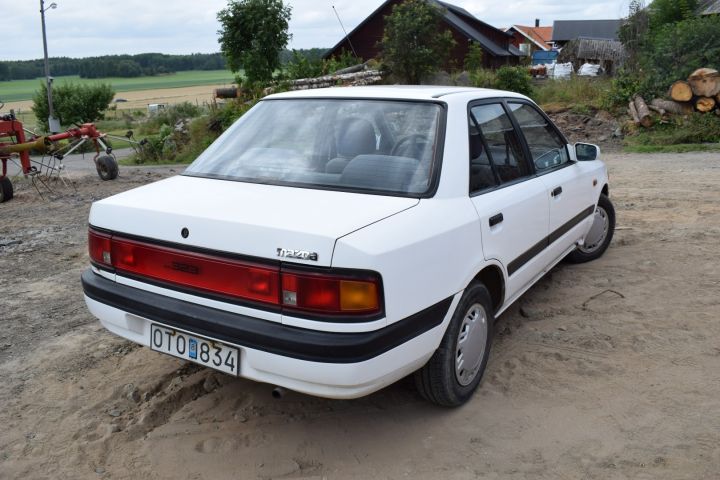 559810-4 Mazda 323 4-D 1.8l 16