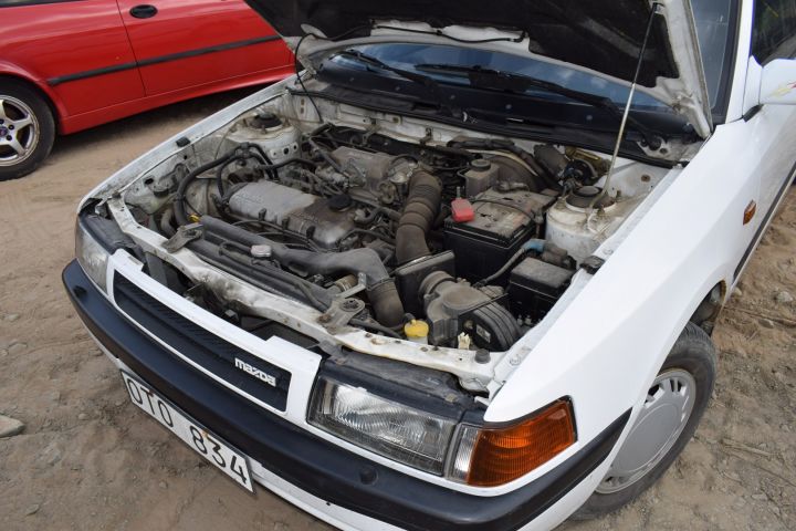 559810-11 Mazda 323 4-D 1.8l 16