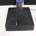 550096-5 Sony Playstation PS4 with controls and games