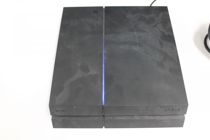 550096-10 Sony Playstation PS4 with controls and games