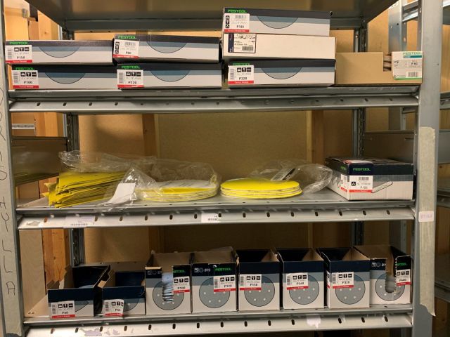 559868-3 Abrasive material including storage shelf