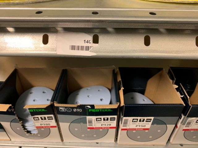 559868-4 Abrasive material including storage shelf