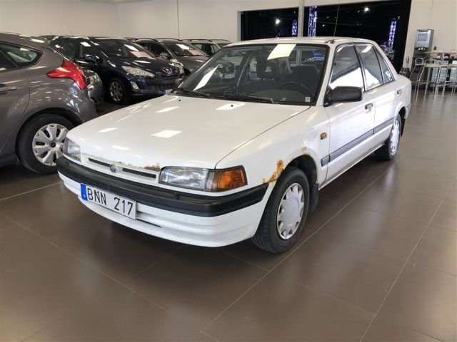 554945-1 Mazda 323 Sedan 1.3 Manual, 73hp, 1995