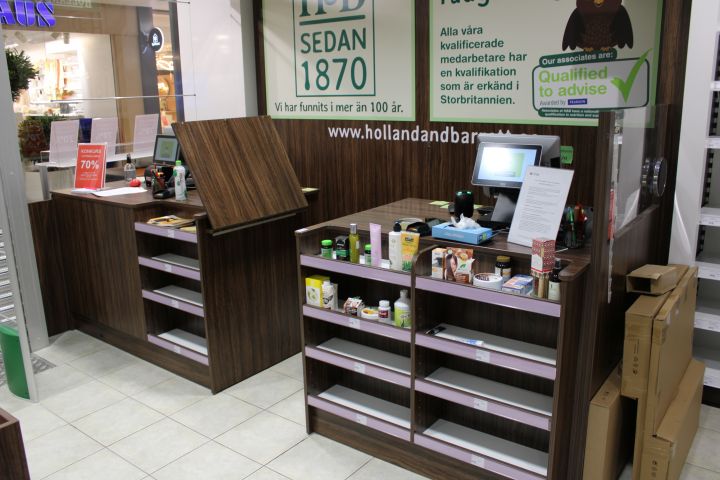 630152-1 Checkout counter with several parts in wood laminate