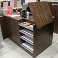 630152-2 Checkout counter with several parts in wood laminate