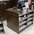 630152-3 Checkout counter with several parts in wood laminate