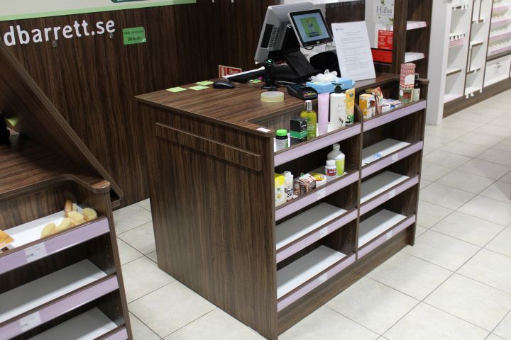 630152-3 Checkout counter with several parts in wood laminate