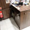 630152-10 Checkout counter with several parts in wood laminate