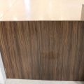 630152-12 Checkout counter with several parts in wood laminate