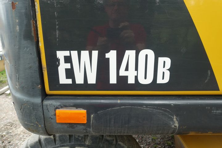 680391-11 Wheeled excavator Volvo EW 140 B
