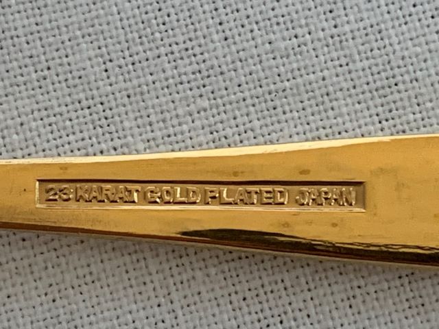 632933-3 Four coffee spoons 23 carat gold plated