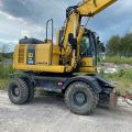 661315-4 Komatsu PW148-8 Wheeled excavator with trailer
