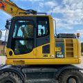 661315-6 Komatsu PW148-8 Wheeled excavator with trailer