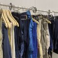 661477-6 Entire women's and men's clothing store, large batch of designer clothes and shop fittings.