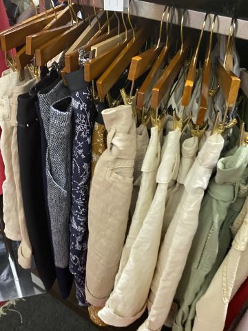 661477-114 Entire women's and men's clothing store, large batch of designer clothes and shop fittings.