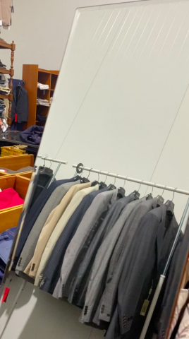 661477-137 Entire women's and men's clothing store, large batch of designer clothes and shop fittings.